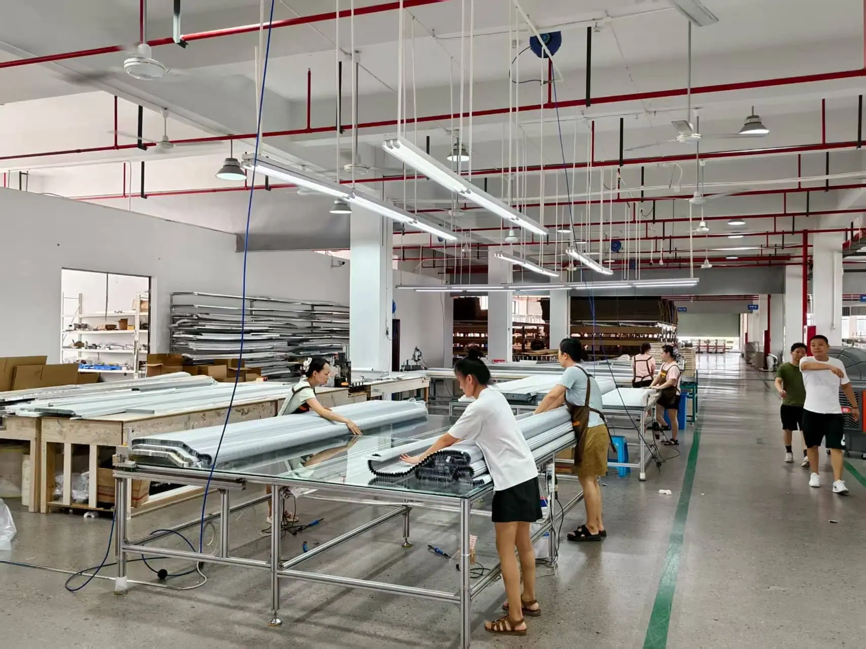 Assembly tables where finished shades are cut and fitted by hand