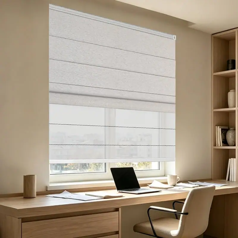 Light cellular shade over a desk in a home workspace
